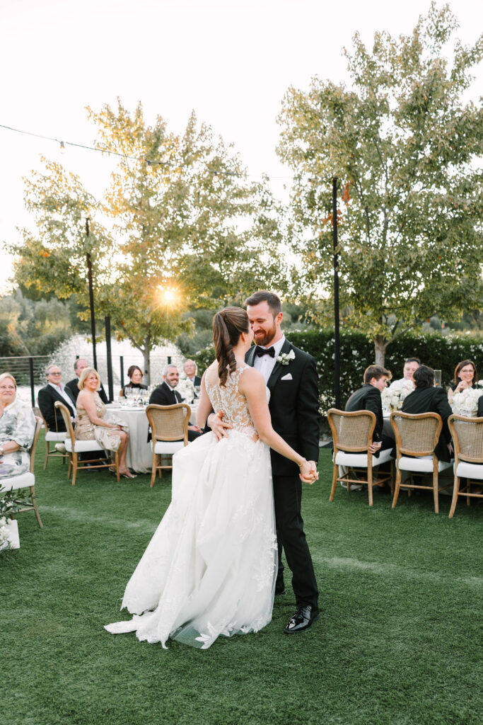 bride and groom dancing at golden hour reception at four seasons Napa valley